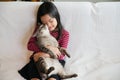 Happy kid at home playing with kitty cat Royalty Free Stock Photo