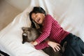 Happy kid at home playing with kitty cat Royalty Free Stock Photo