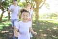 Happy kid Jogging with parents in the city park Royalty Free Stock Photo