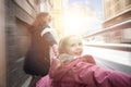 Happy kid laughing with mother outdoor, motion Royalty Free Stock Photo