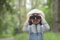 Happy kid looking ahead. Smiling child with the binoculars. Travel and adventure concept. Freedom, vacation Royalty Free Stock Photo