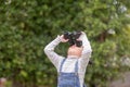 Happy kid looking ahead. Smiling child with the spyglass. Travel and adventure concept. Freedom, vacation Royalty Free Stock Photo