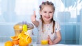 Happy kid making orange juice Royalty Free Stock Photo