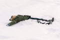 Happy kid making snow angel. Boy playing on a winter walk in nature. Child enjoying snowy weather Royalty Free Stock Photo