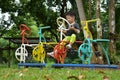 Happy kid playing bicycle stand in outdoor park playground Royalty Free Stock Photo