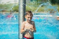 Happy kid playing in blue water of swimming pool on a tropical r Royalty Free Stock Photo