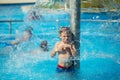 Happy kid playing in blue water of swimming pool on a tropical r Royalty Free Stock Photo