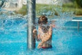 Happy kid playing in blue water of swimming pool on a tropical r Royalty Free Stock Photo