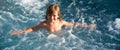 Happy kid playing in outdoor swimming pool on hot summer day. Kids learn to swim. Child in water. Children play in Royalty Free Stock Photo