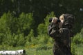 Happy kid playing outdoors with binocular. Travel and adventure concept