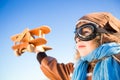 Happy kid playing with toy airplane Royalty Free Stock Photo