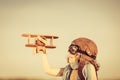 Happy kid playing with toy airplane Royalty Free Stock Photo