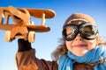 Happy kid playing with toy airplane Royalty Free Stock Photo