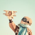 Happy kid playing with toy airplane Royalty Free Stock Photo