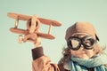 Happy kid playing with toy airplane Royalty Free Stock Photo