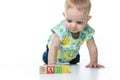 Happy kid playing toy blocks isolated on white background Royalty Free Stock Photo