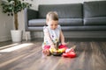 Happy kid playing toy at home Royalty Free Stock Photo