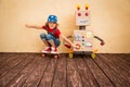 Happy kid playing with toy robot Royalty Free Stock Photo