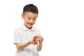 Happy kid playing toy wearing white shirt Royalty Free Stock Photo