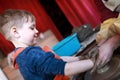 Happy kid at potters wheel Royalty Free Stock Photo