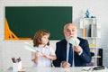 Happy kid in school break. Teacher with pupil with airplanes. Education, teachering, elementary school. Royalty Free Stock Photo