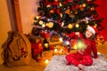 Happy Kid showing lighting lamppost in front of Christmas tree Royalty Free Stock Photo