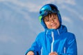 Happy skier teen portrait over mountains