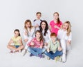 Happy kids and adults standing at white background, copy space Royalty Free Stock Photo