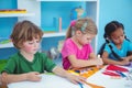 Happy kids all drawing pictures Royalty Free Stock Photo