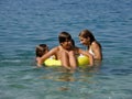 Happy kids with beach toys on sea Royalty Free Stock Photo