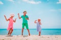 Happy kids- boy and girls- dance at beach vacation Royalty Free Stock Photo