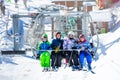 Happy kids in bright ski outfit on chairlift Royalty Free Stock Photo