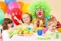 Happy kids celebrating birthday party with clown Royalty Free Stock Photo