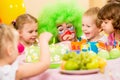 Happy kids celebrating birthday party with clown Royalty Free Stock Photo