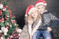 Happy kids at Christmas holiday near decorated christmas tree Royalty Free Stock Photo