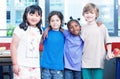 Happy kids in classroom. Multirace concept Royalty Free Stock Photo