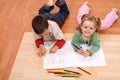Happy kids coloring the tale book Royalty Free Stock Photo