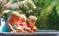 Happy kids drinking coconut cocktail on beach resort Royalty Free Stock Photo