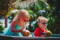 Happy kids drinking coconut cocktail on beach resort Royalty Free Stock Photo