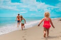 Happy kids enjoy beach vacation, boy and girls have fun Royalty Free Stock Photo