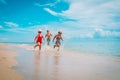 Happy kids enjoy beach vacation, boy and girls have fun Royalty Free Stock Photo