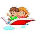 Happy kids flying on big open book Royalty Free Stock Photo