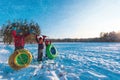 Happy kids go to slide in winter snow, kids have fun outside Royalty Free Stock Photo