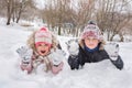 Happy kids have fun playing outdoors in winter. Winter vacation and holidays Royalty Free Stock Photo