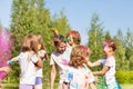 Happy kids having fun with colored powder outside Royalty Free Stock Photo