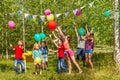 Happy kids having fun playing balloons outside Royalty Free Stock Photo