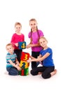 Happy kids holding blocks with numbers over white background Royalty Free Stock Photo