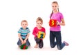 Happy kids holding blocks with numbers over white background Royalty Free Stock Photo