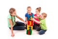 Happy kids holding blocks with numbers over white background Royalty Free Stock Photo