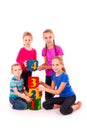 Happy kids holding blocks with numbers over white background Royalty Free Stock Photo